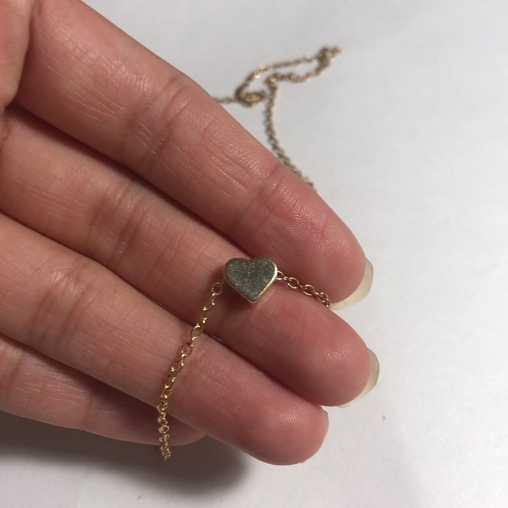 Gold heart charm necklace